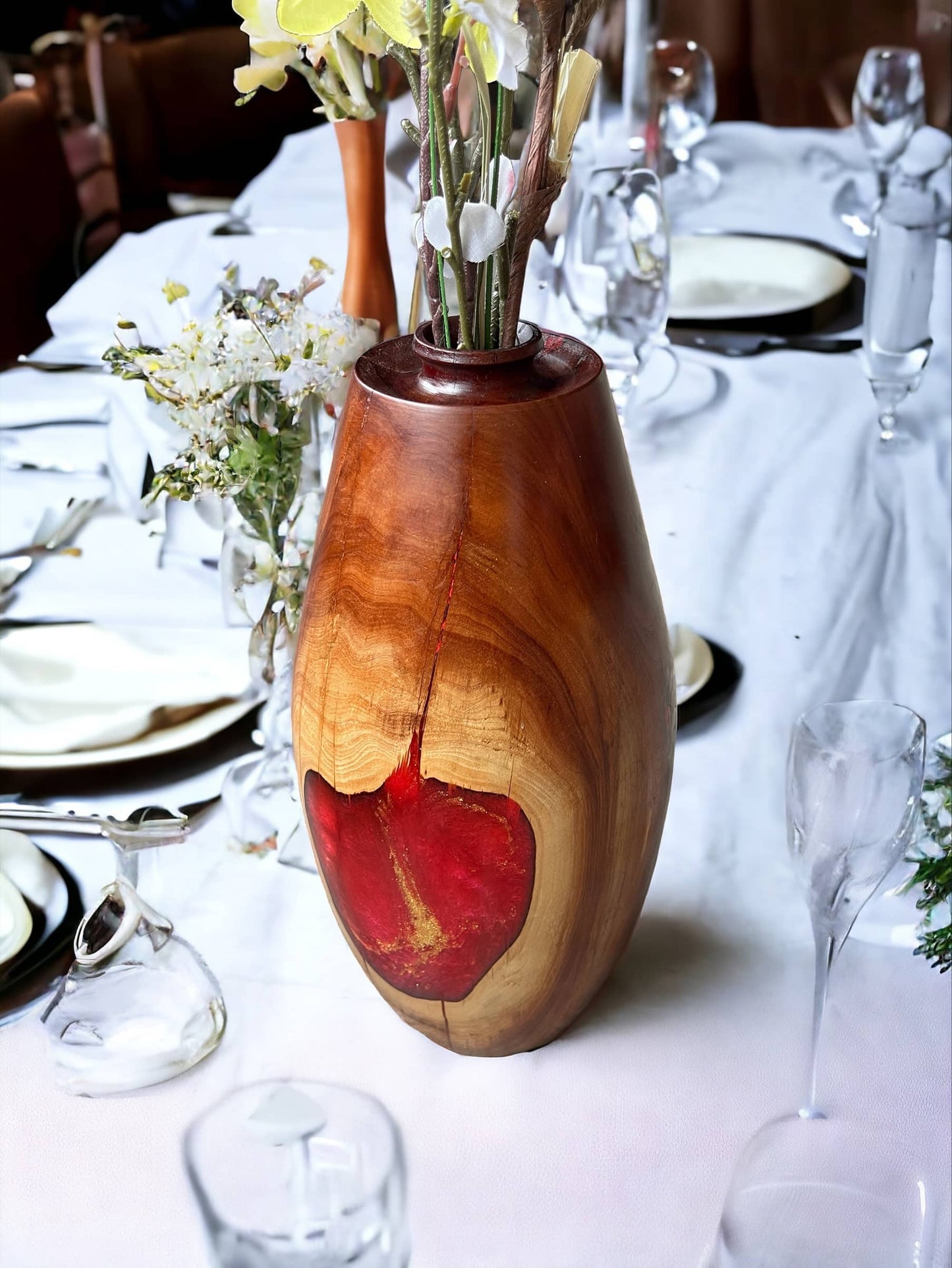 Manzanita wood vase with red resin inlay. Tabletop decoration.